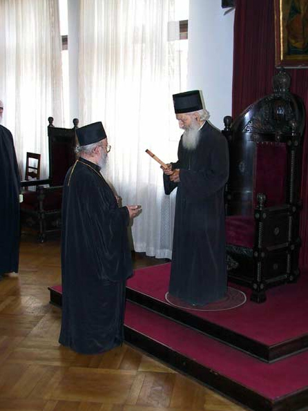 Serb Bishop Artemije gives to Serb Patriarch Pavle a woodcarved cross as a gift of the monks from RAska and Prizren Diocese, Serbia