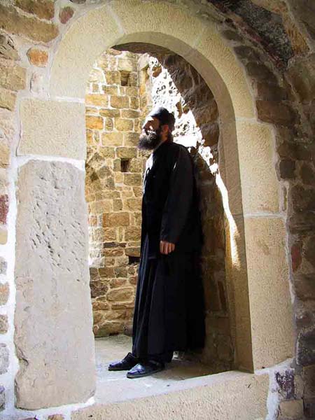 Serb monk meditating in an old monastery tower, Djurdjevi Stupovi Monastery, Serbia