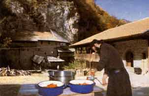Serb monk making tomato juice - getting ready for the winter