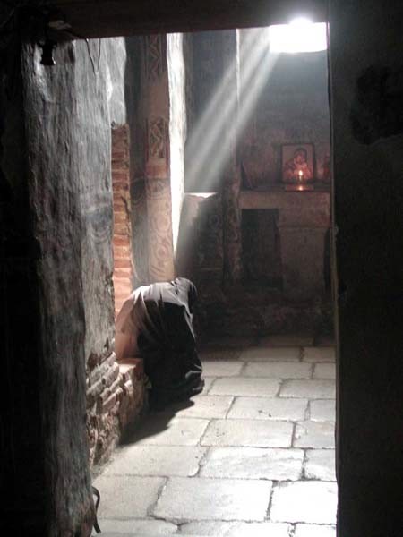 Serb nun praying at Gracanica Monastery, Serbia