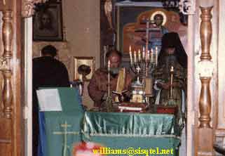 From L. to R - Fr. Herman, Fr. Deacon (now Priest) Vladimir Anderson, and Bl. Seraphim serving in the old church at the Saint Herman of Alaska Monastery - Copyright  The Blessed Seraphim Hermitage
