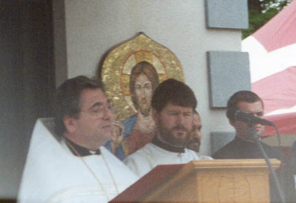 6. Vigil - Reading the proclamation of the holy synod of the Orthodox Church in America, regarding the glorification of St. Raphael, is V. Rev. Fr. Robert Kondratick, Chancelor of the OCA. Standing next to him is Fr. Deacon John Hopko. This is at the very beginning of Vigil service, just after all the clergy and the relics have processed in