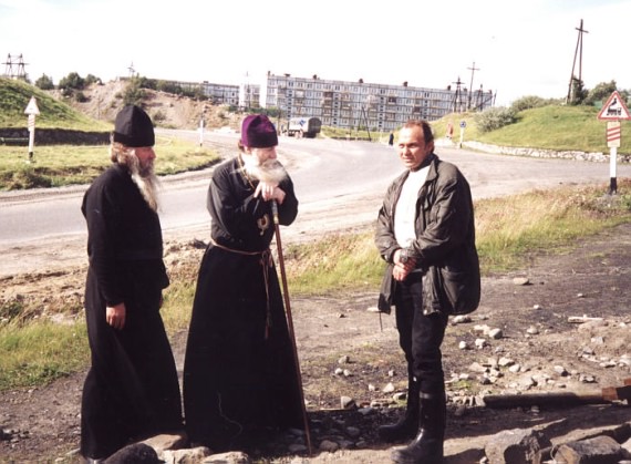 Russian Bishop talking to a lay man and a father