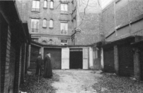 Archbishop John's Paris 'Cathedral', actually a garage church, in the 1950's. Before it stand Fr. Mitrophan, a disciple of Archbishop John