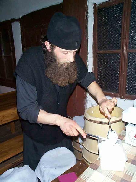 Fr. Daniel processing the milk cream, Visoki Decani Monastery, Serbia
