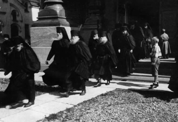 Fathers walking out of a monastery